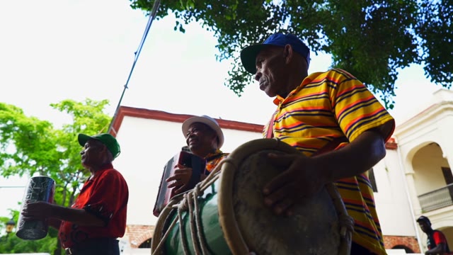 Three Adults Musician Playing Outdoors