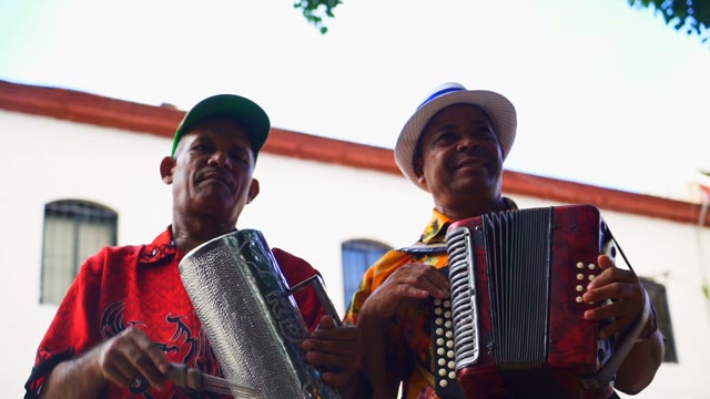 Two Musicians Playing In The Street
