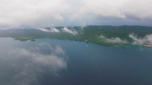 An Incredible View Of The Top On A Green Island In The Middle Of The Ocean