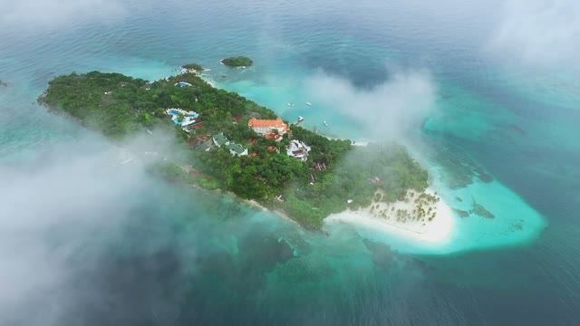 Top View Of White Clouds On A Beautiful Island In The Middle Of The Ocean