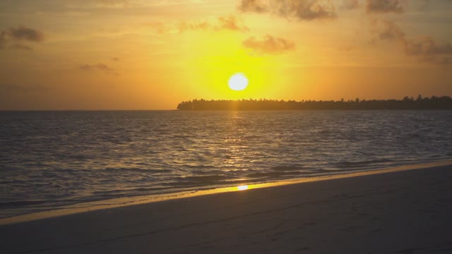 Golden Sunset And Ocean Waves On The Island