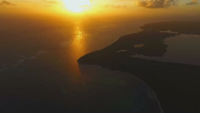 View Of The Golden Sun At Sunset And The Island In The Ocean
