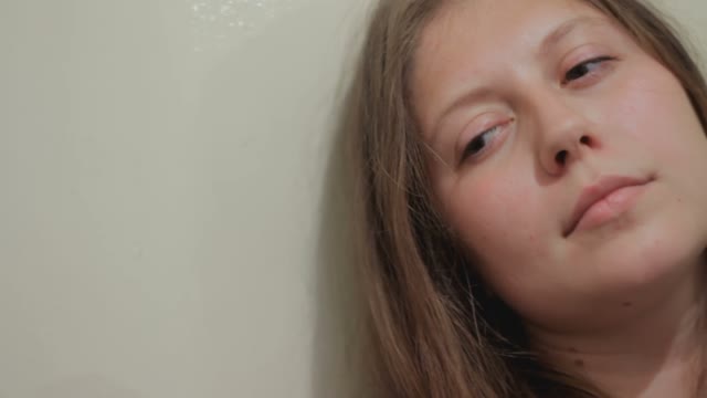 Young Girl Listening To The Keyhole