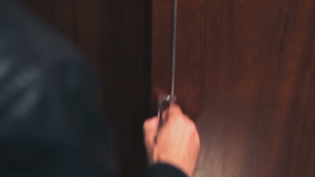 Frightened Young Woman Sitting In The Closet