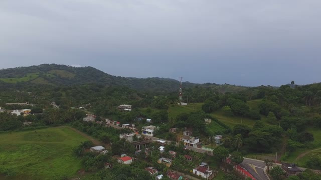An Incredible View Of The Top At The Green Mountains And The Small Settlements