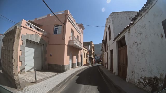 Car Is Moving Through A Very Narrow Street