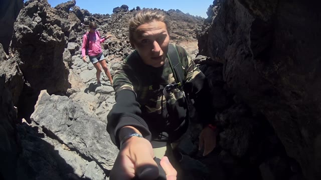 Man Is Filming Him And His Woman In The Mountains