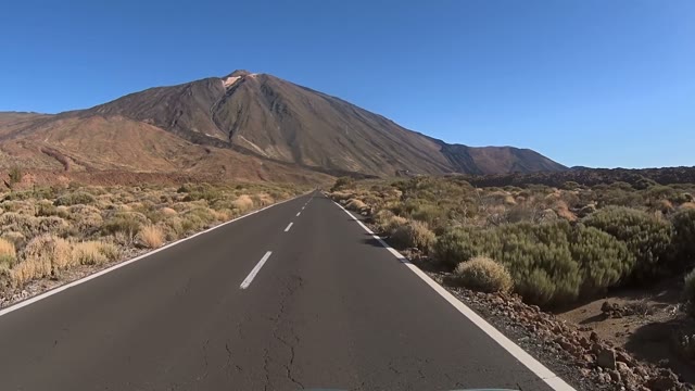 Car Is Going Up The Road To The Mountain