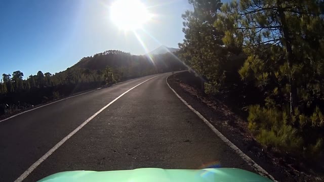 Car Moving Down A Mountain Road Very Fast