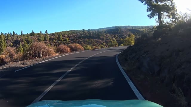 Car Moving Down Road Mountains