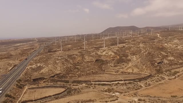 Lots Of Windmills In The Valley Near The Sea