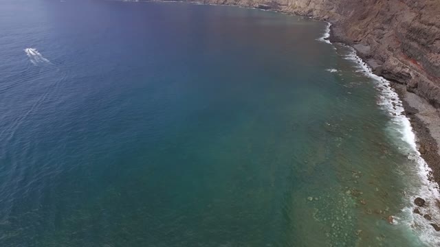 A Little Ship In The Open Sea Near The Coastline, Aerial