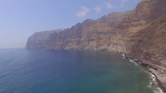 A Slow Motion Shot Of The Rocky Coastline, Aerial