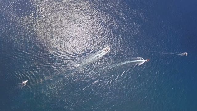 Four Ships Floating On Open Sea, Aerial View