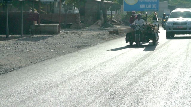 People On The Bike With A Load