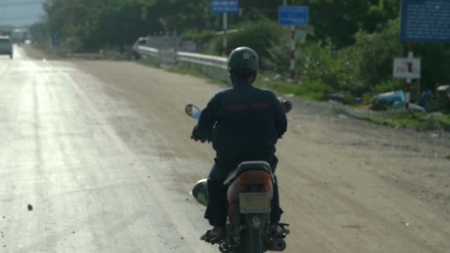 Man Riding Moped Close