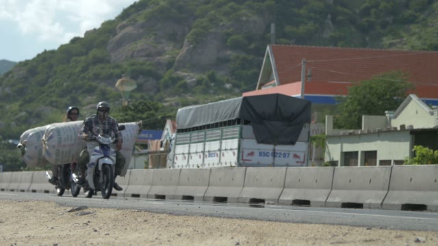 Men Driven Load On A Motorcycle