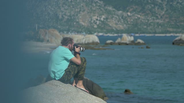 Man Photographs The Sea