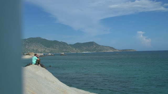 Man Photographs The Sea