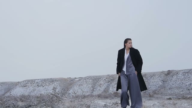 Model In Trendy Outfit Posing Outdoors In The Snow