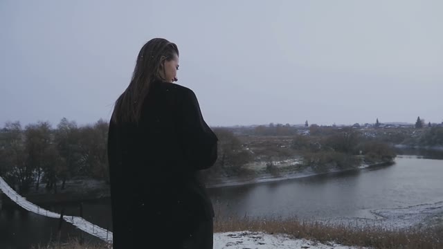 The Brunette During A Snowfall At The River