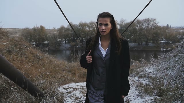 Tanned Girl In A Suit Going On The Snow