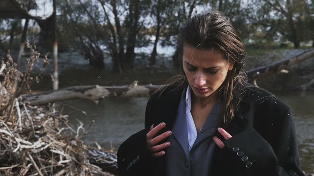 Girl In A Suit On A Background Of Dry Branches