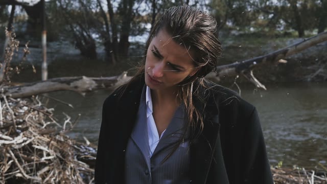 The Girl On The Background Of The River During A Snow Autumn