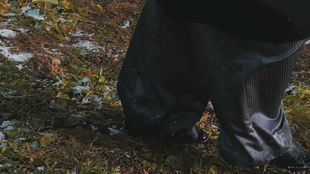 Female Legs In Wide Pants Go Through The Ground