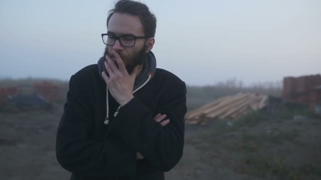 The Guy Wearing Glasses Wanders On The Road And Is Angry