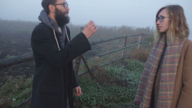 Boy And Girl Waving Their Hands And Quarrel