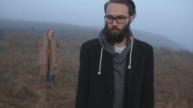Man With Glasses Thinking Among Fog
