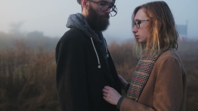 A Pair Of Hipsters Pressed Against Each Other