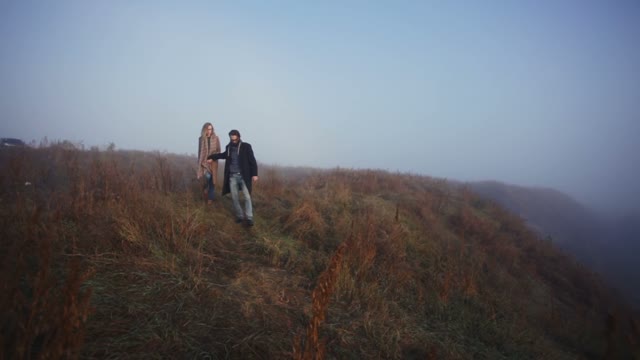 Couple In Love Walking In The Hills