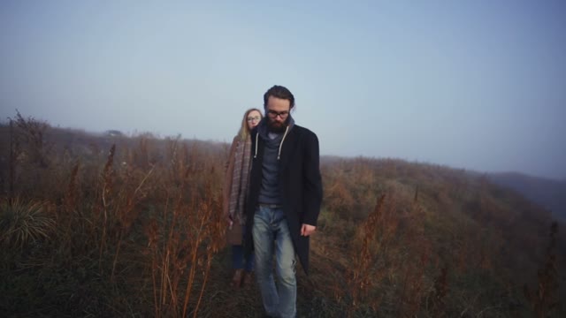 Loving Couple Walking Among The Reeds