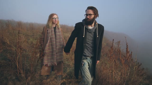 The Guy And The Girl Go For The Hand On The Field
