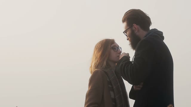 Infatuated Tall Guy Touches The Hair Of His Girlfriend