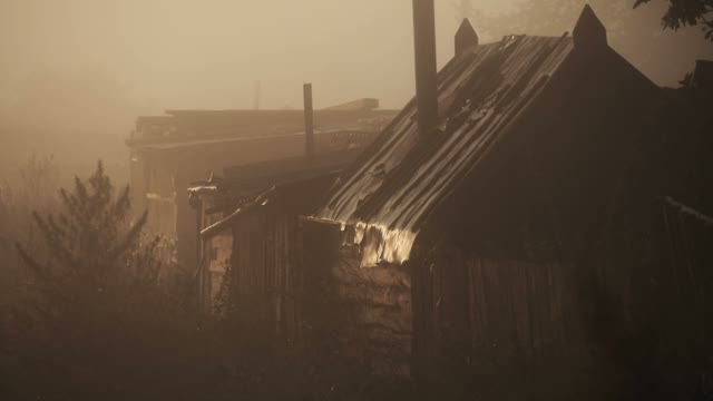 View Of The Houses In The Fog, And In The Light Of The Setting Sun