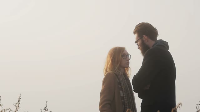 Girl In Glasses Admiring At Her Boyfriend During The Sunset