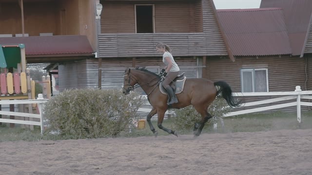 Girl Jockey Jump On His Brown Horse