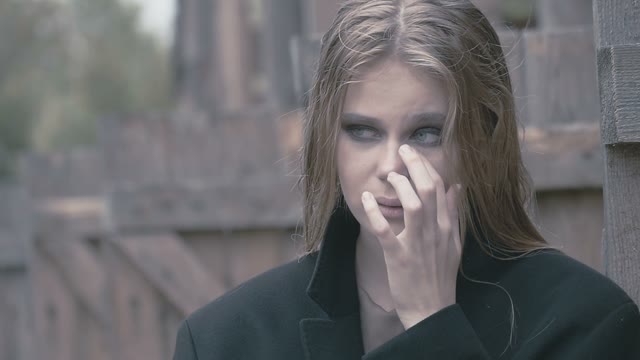 Portrait Of A Beautiful Blonde Girl In A Coat