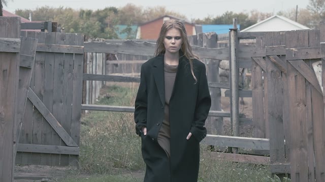 Pretty Girl Model Presents Fashionable Clothes On A Background Of Farming