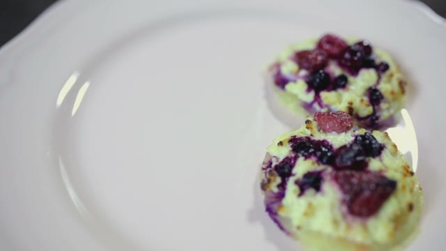 Female Hand Puts A Cake On A Plate