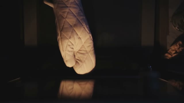 Hand Puts Forward Cakes From The Oven
