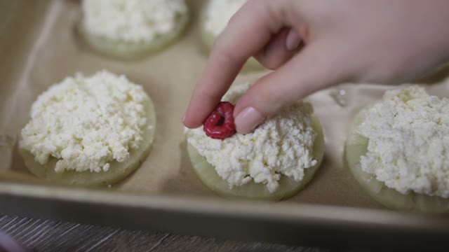 Hand Puts Berries On Cake Close-up