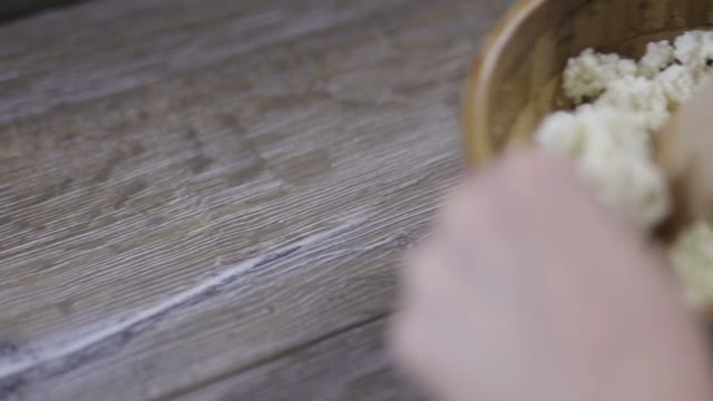 Women's Hands Stirred Curd