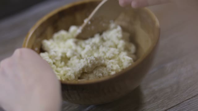 Hands Stirred Curd Close-up