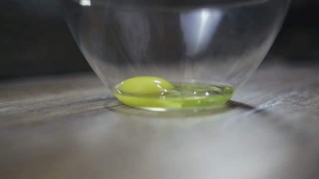 Egg Is Broken Into A Bowl Close-up