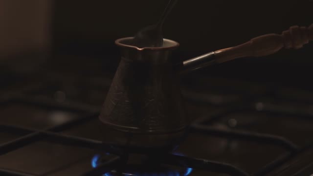 Coffee Cezve Is Stirred With A Spoon