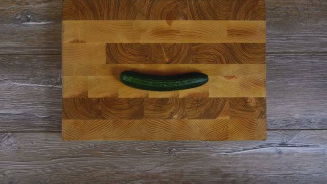 Female Hands Sliced Cucumber